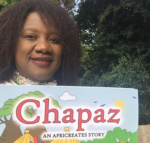 Dot holding her book Chapaz